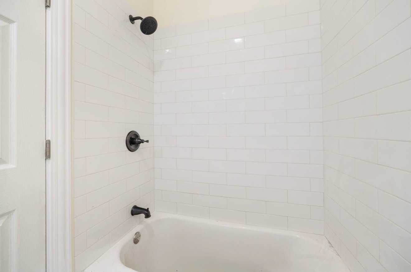 5617 South Laflin Street, Unit 2 Chicago, IL 60636 - Photo 6 of 9 a close up of a bathtub curtain