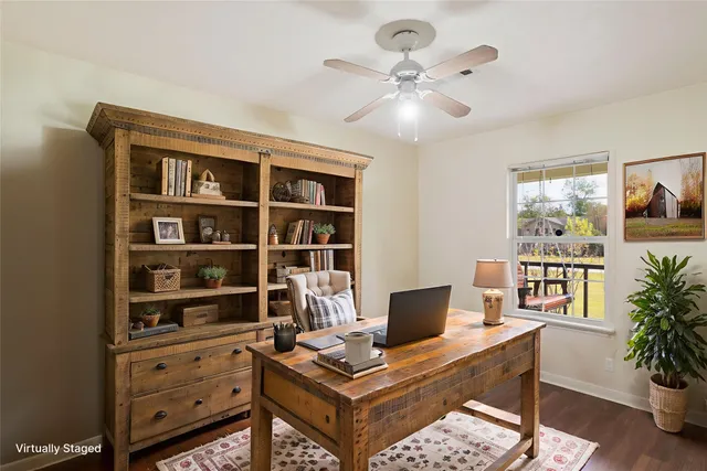 a view of a workspace with a bookshelf