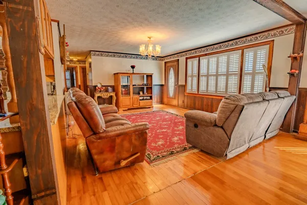 a kitchen with stainless steel appliances granite countertop a sink and cabinets
