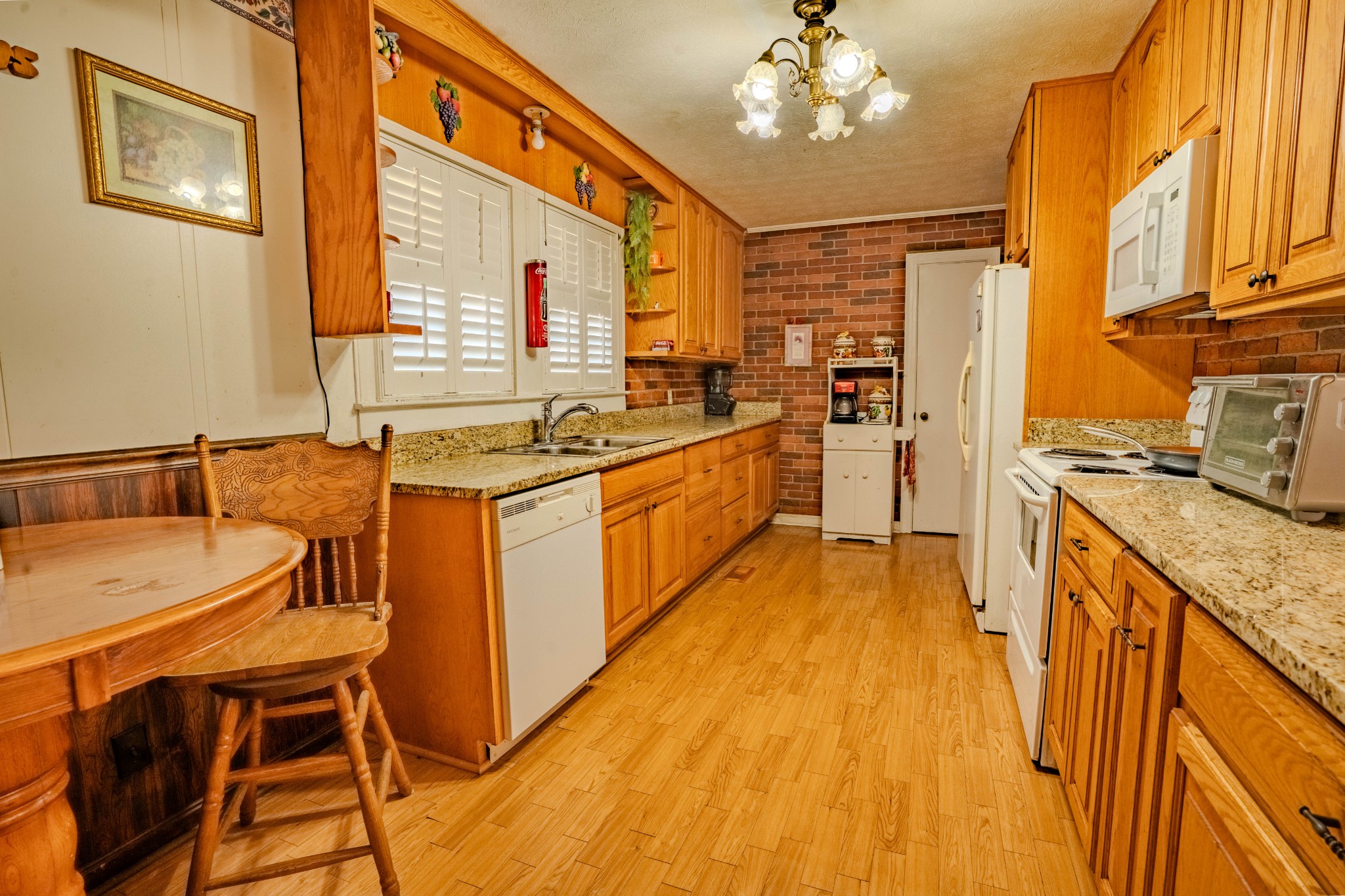 25 Peters Lane Loretto, TN 38469 - Photo 18 of 44 a kitchen with stainless steel appliances granite countertop a sink and cabinets