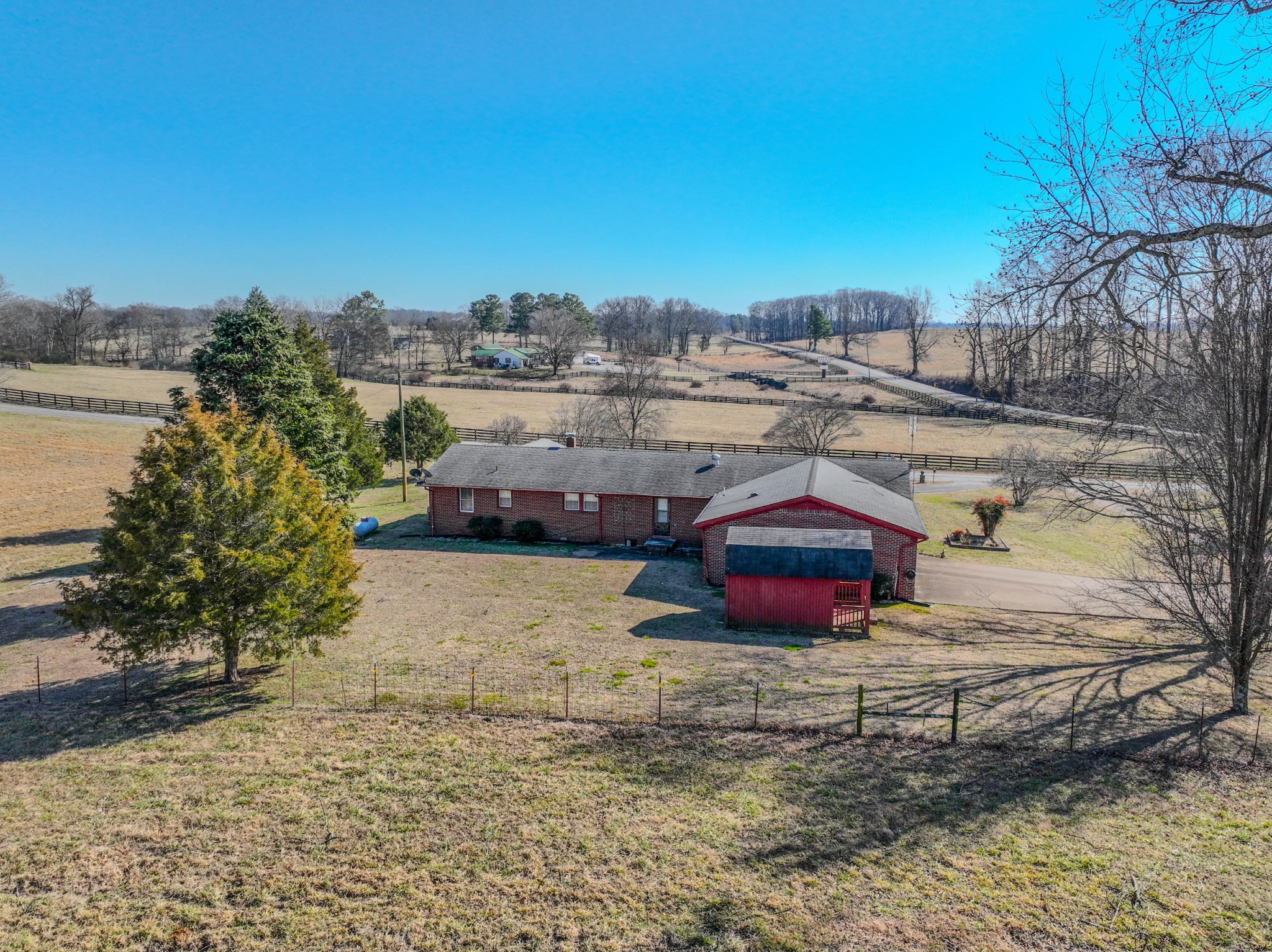 25 Peters Lane Loretto, TN 38469 - Photo 5 of 44 a tall yellow building in the middle of a yard