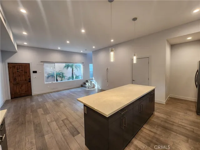 a spacious bathroom with a sink a large mirror and a shower