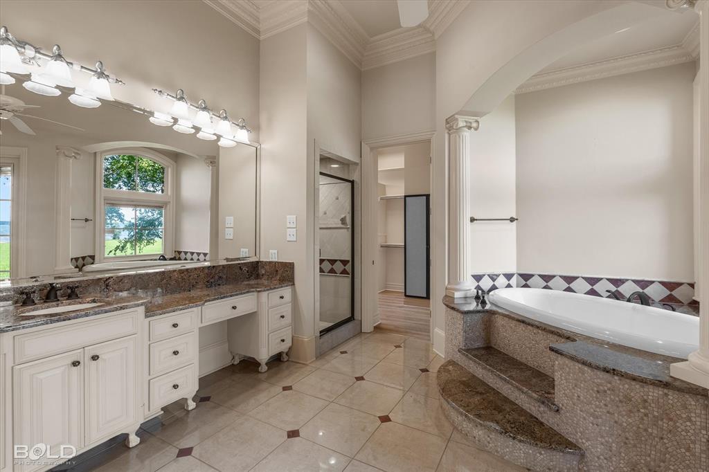 10099 Ferry Lake Road Oil City, LA 71061 - Photo 8 of 14 Luxurious primary bath with exceptional space and finishes