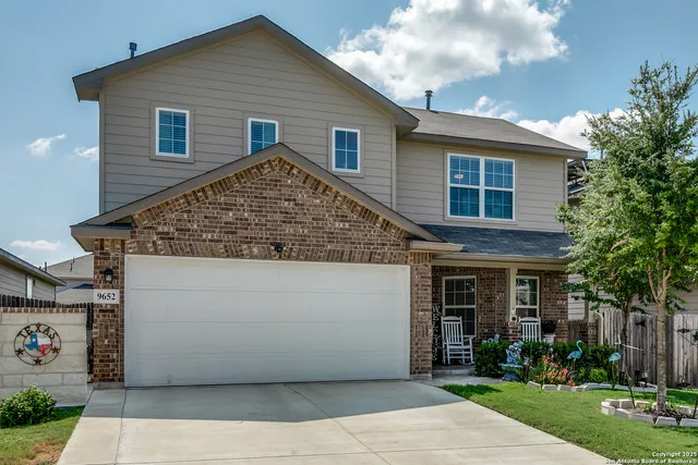 a view of house with yard