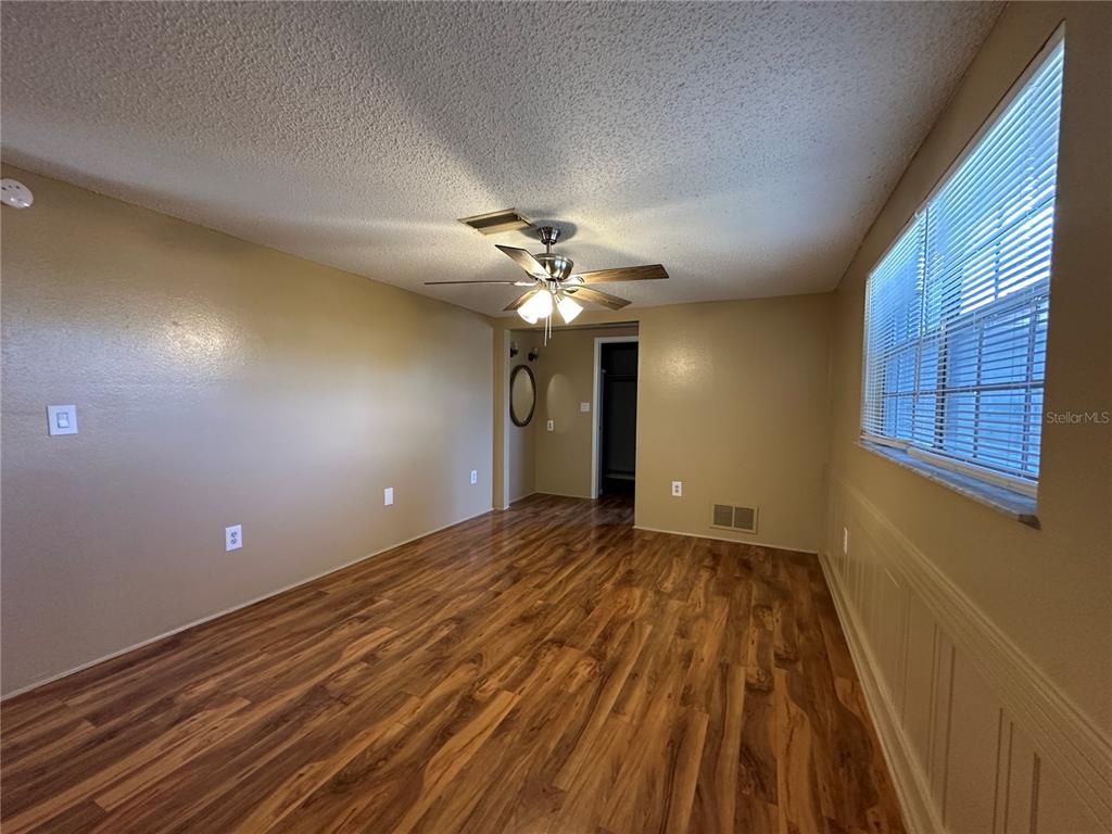 8809 Avondale Lane Hudson, FL 34667 - Photo 14 of 46 a view of a livingroom with a ceiling fan and window