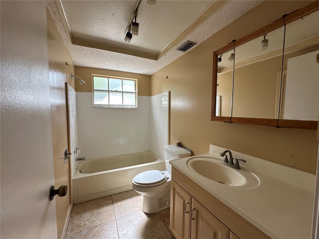 8809 Avondale Lane Hudson, FL 34667 - Photo 15 of 46 a bathroom with a sink toilet and shower
