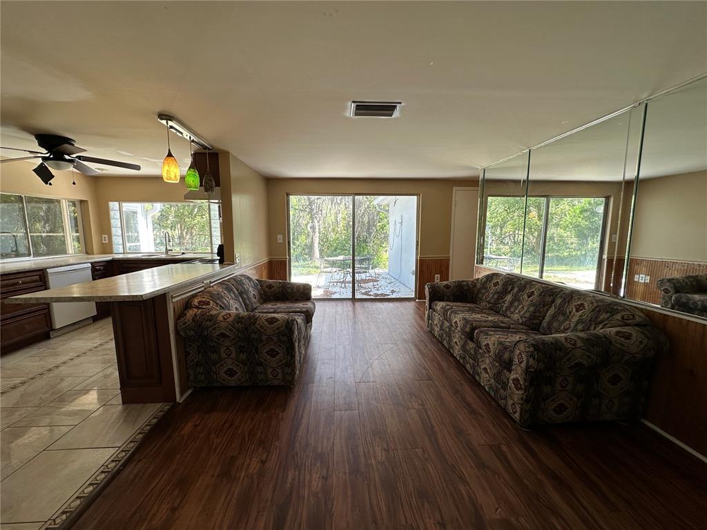 8809 Avondale Lane Hudson, FL 34667 - Photo 21 of 46 a living room with furniture and a large window