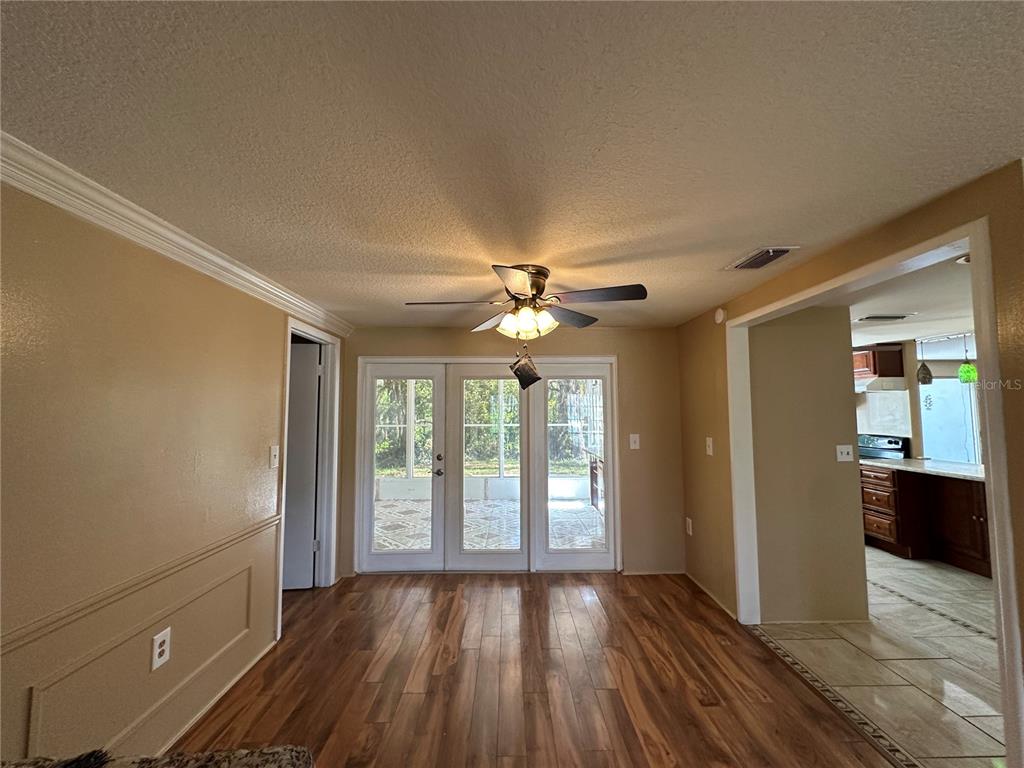 8809 Avondale Lane Hudson, FL 34667 - Photo 25 of 46 wooden floor in an empty room with a window