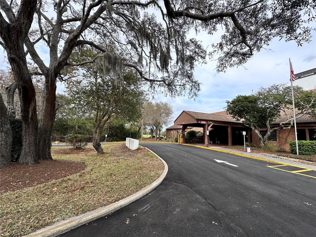 8809 Avondale Lane Hudson, FL 34667 - Photo 31 of 46 a front view of a house with a yard and trees