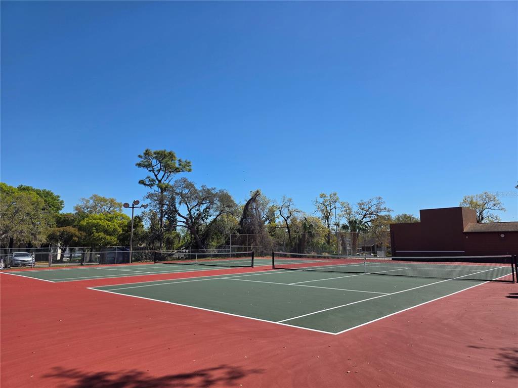 8809 Avondale Lane Hudson, FL 34667 - Photo 40 of 46 a view of a tennis court