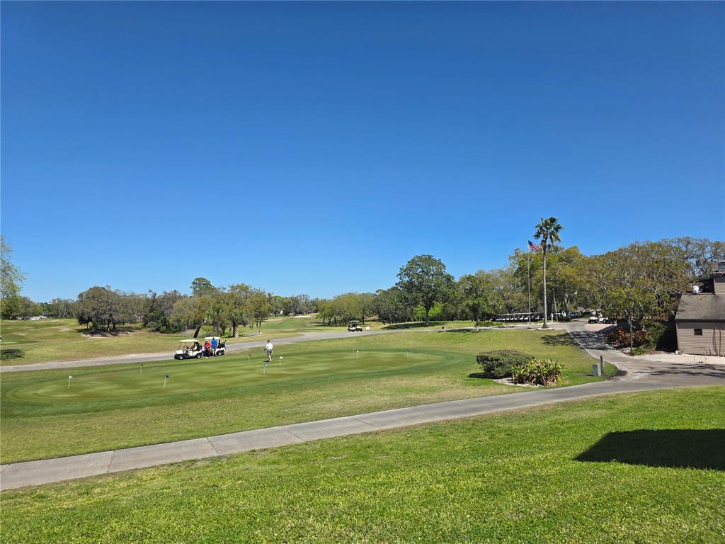 8809 Avondale Lane Hudson, FL 34667 - Photo 46 of 46 a view of a golf course with a lake view