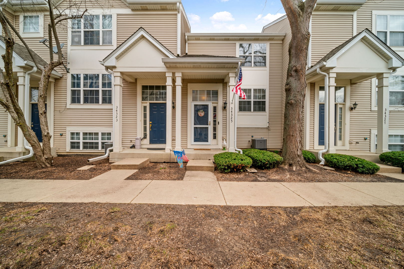 34325 North Barberry Road Round Lake, IL 60073 - Photo 1 of 21 a front view of a house with garden