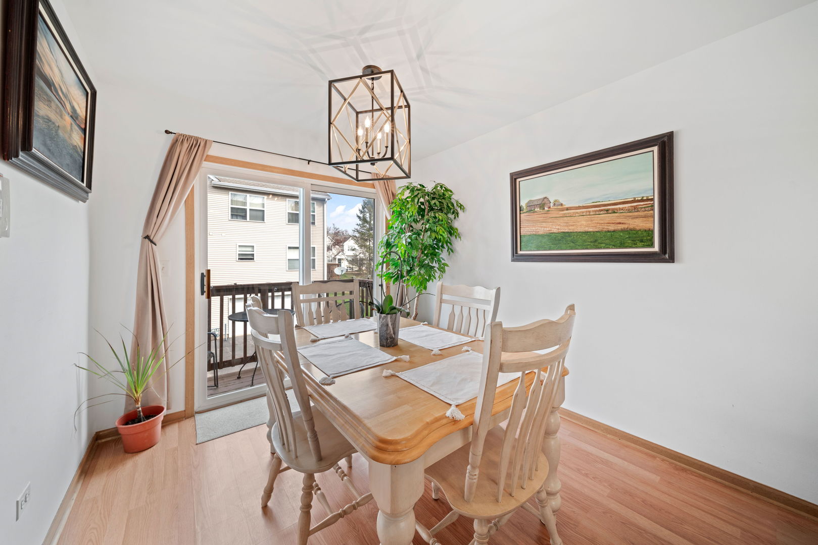34325 North Barberry Road Round Lake, IL 60073 - Photo 7 of 21 a view of a dining room with furniture and wooden floor