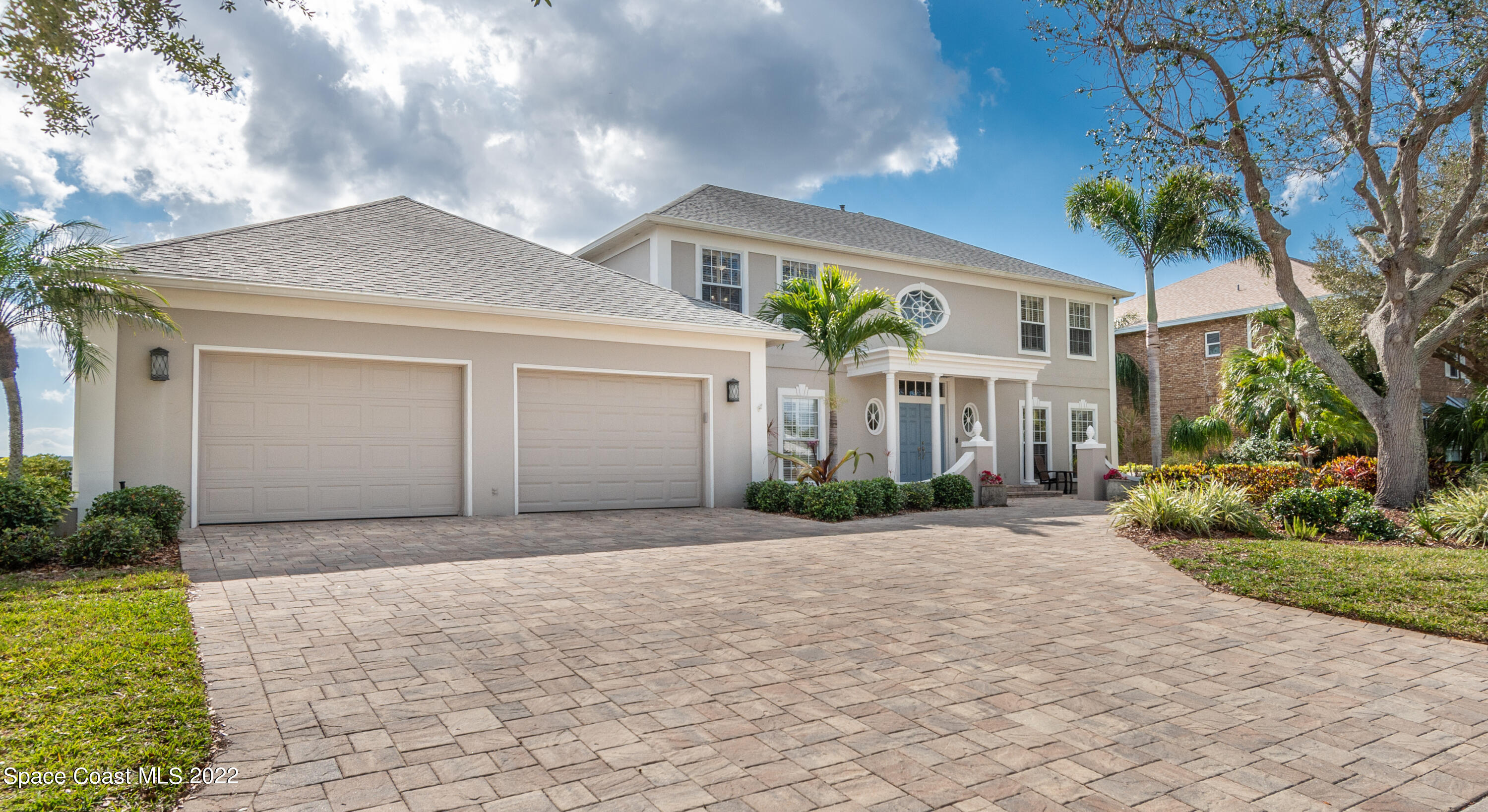 870 Kerry Downs Circle Melbourne, FL 32940 - Photo 1 of 41 a front view of house with yard and trees around