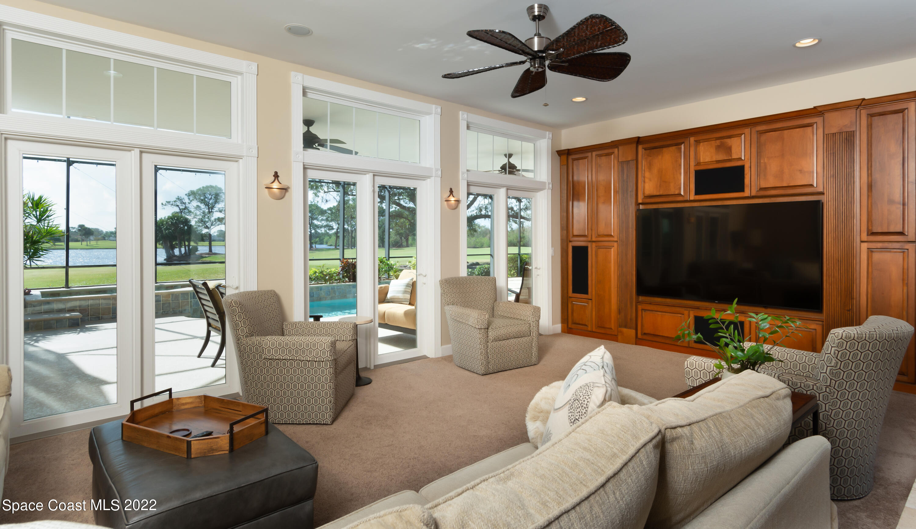 870 Kerry Downs Circle Melbourne, FL 32940 - Photo 14 of 41 a living room with furniture and a flat screen tv