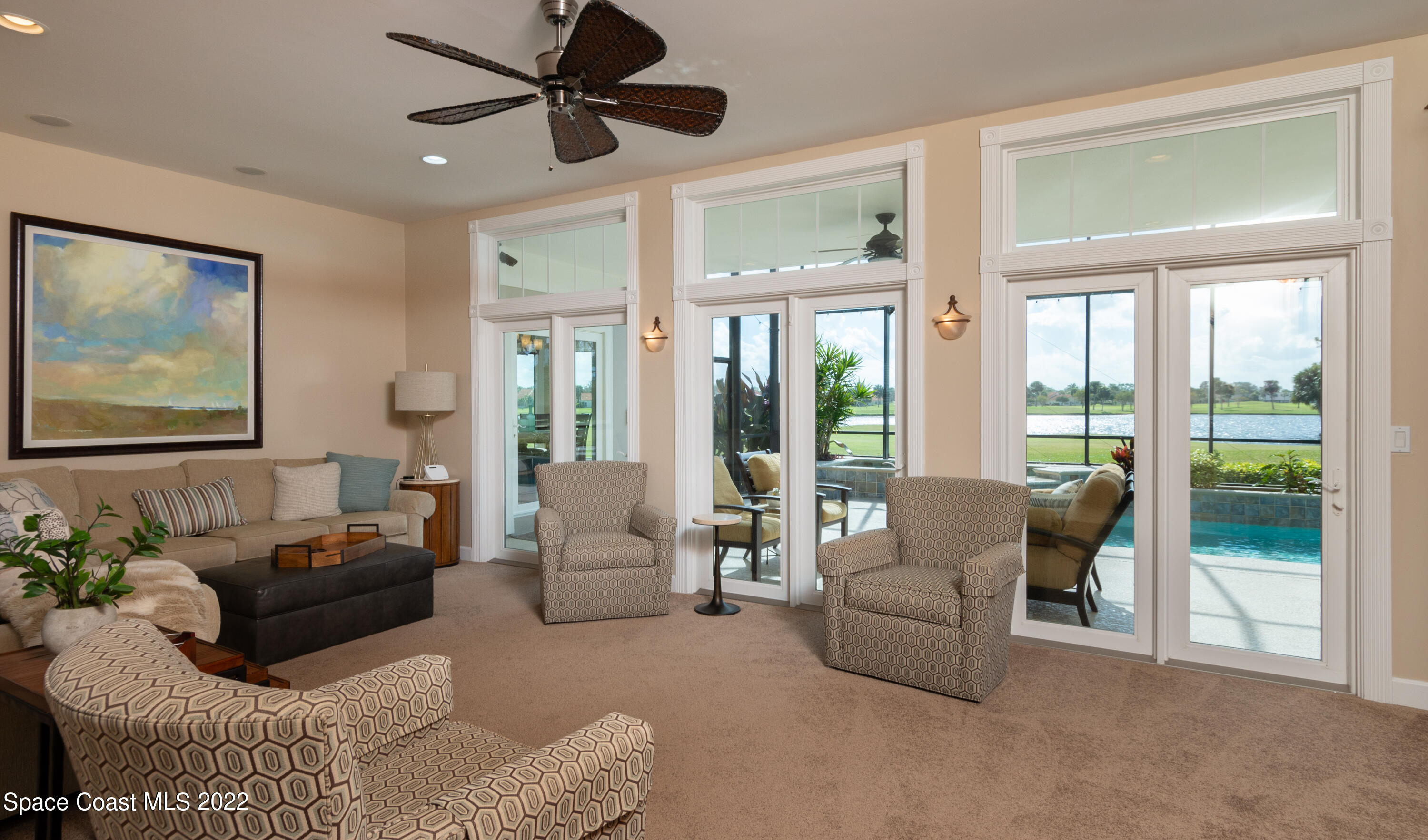 870 Kerry Downs Circle Melbourne, FL 32940 - Photo 15 of 41 a living room with furniture and a large window