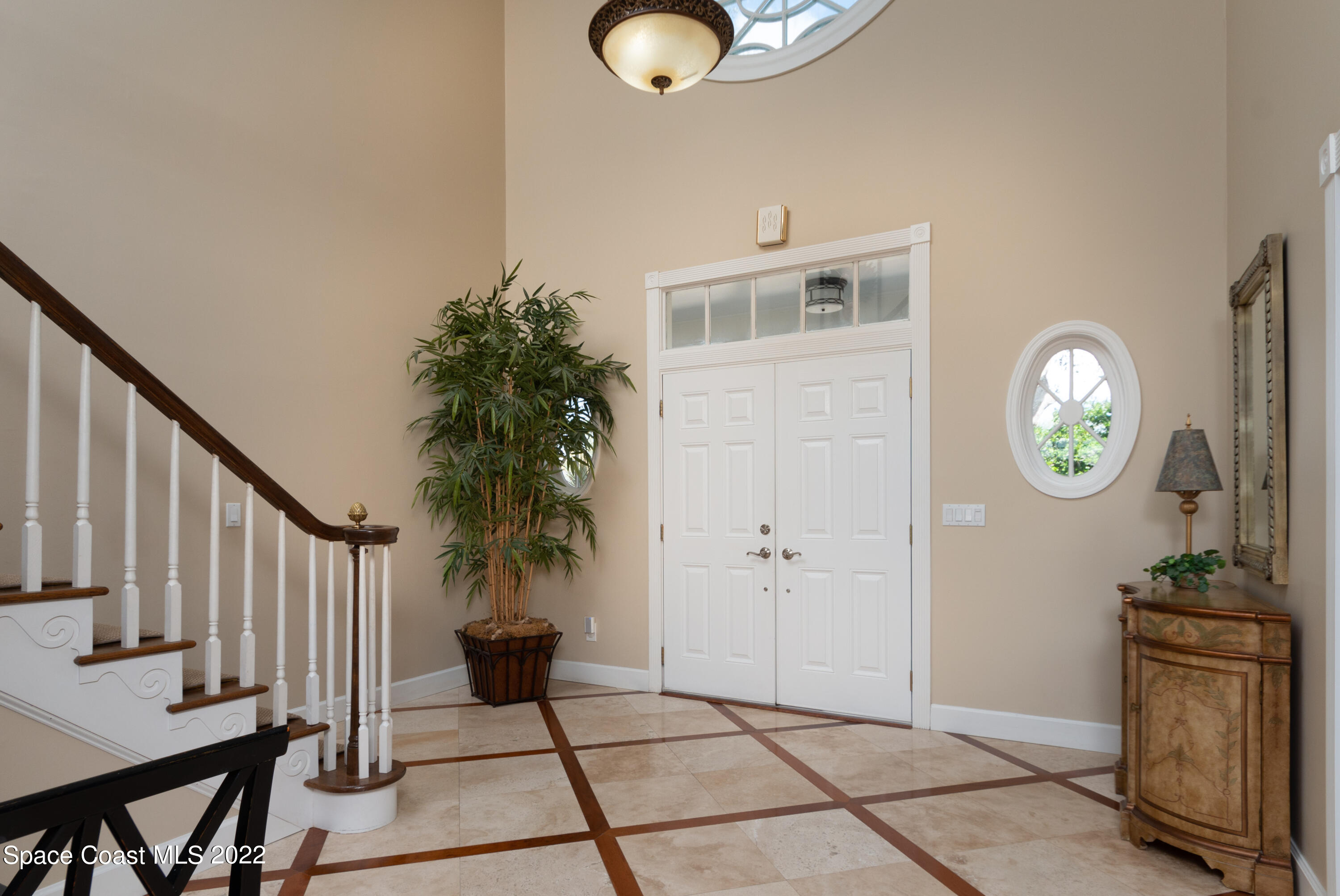 870 Kerry Downs Circle Melbourne, FL 32940 - Photo 17 of 41 a view of a hallway to a livingroom with furniture