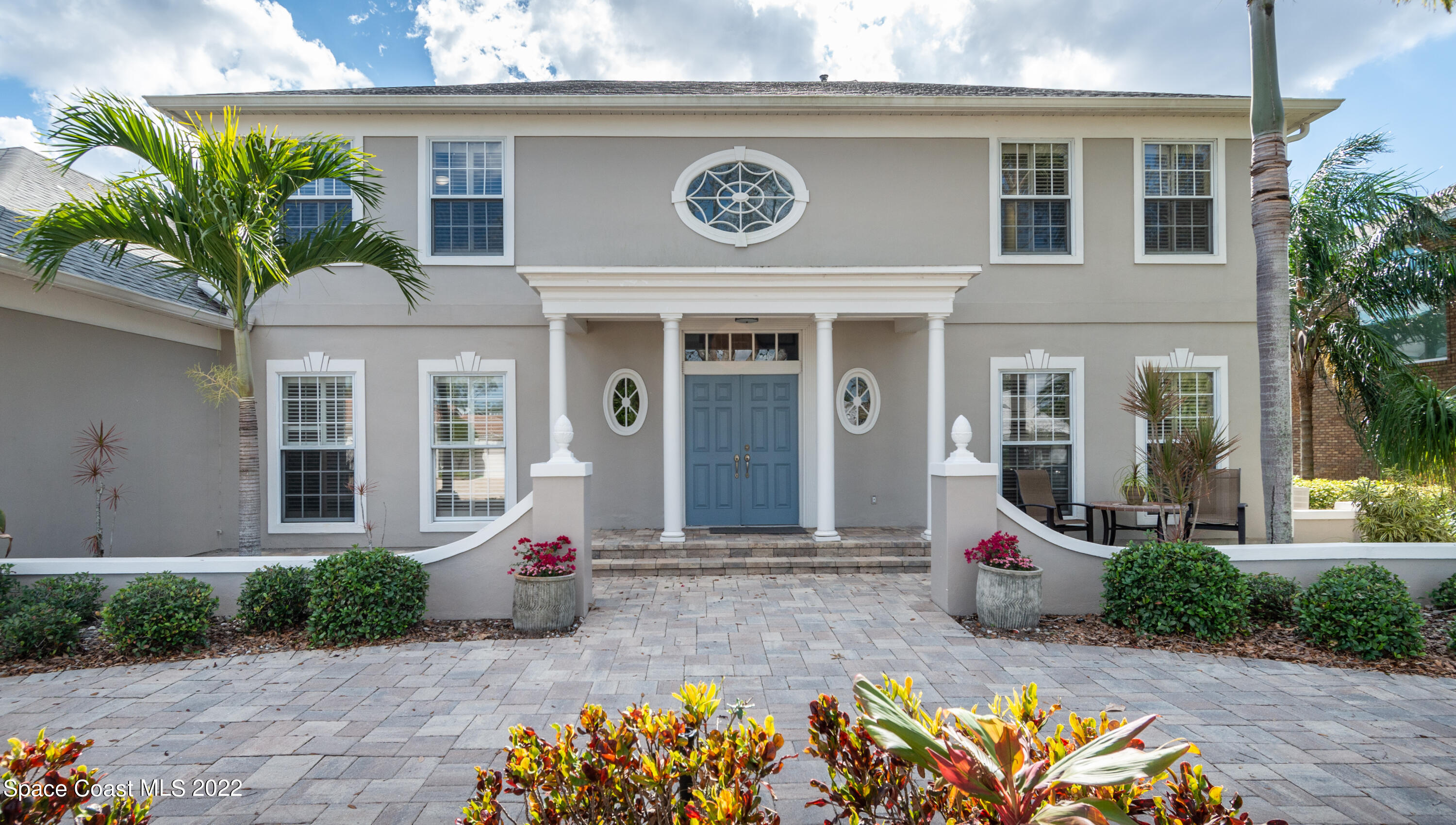 870 Kerry Downs Circle Melbourne, FL 32940 - Photo 2 of 41 a view of a house with outdoor seating