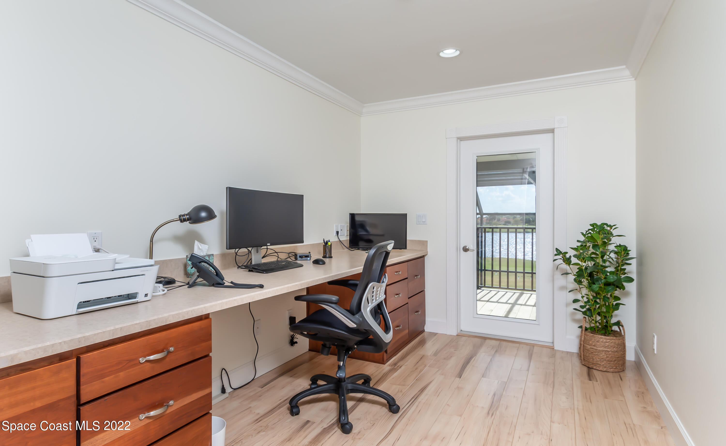 870 Kerry Downs Circle Melbourne, FL 32940 - Photo 21 of 41 a view of a workspace with furniture and a window