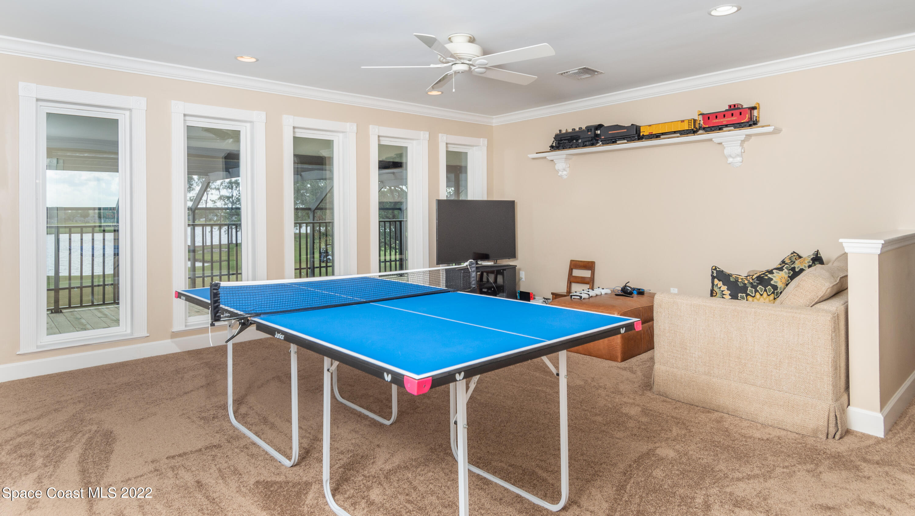 870 Kerry Downs Circle Melbourne, FL 32940 - Photo 22 of 41 a blue kitchen with a stove and a refrigerator
