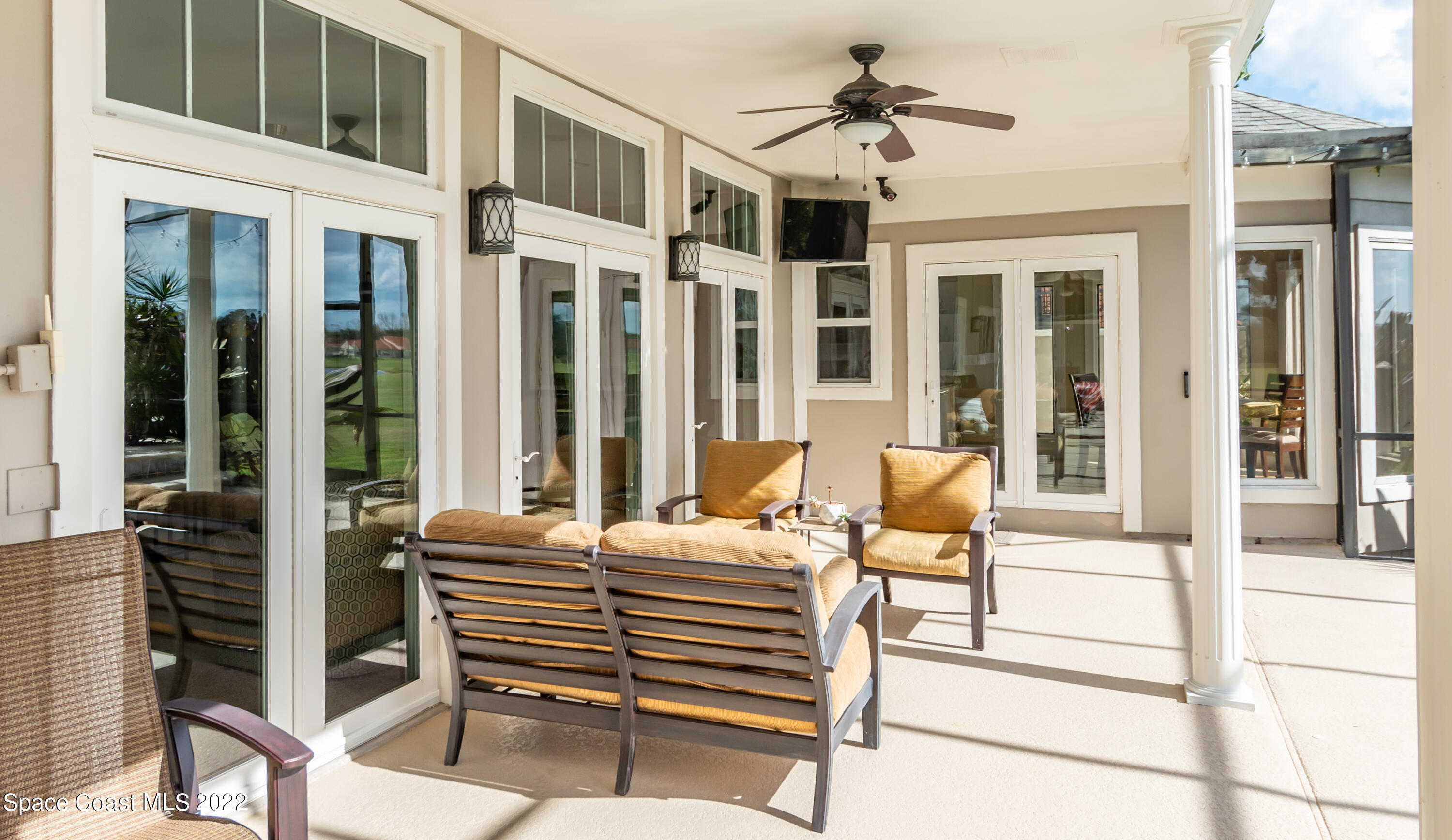 870 Kerry Downs Circle Melbourne, FL 32940 - Photo 30 of 41 a outdoor space with a large window and couch