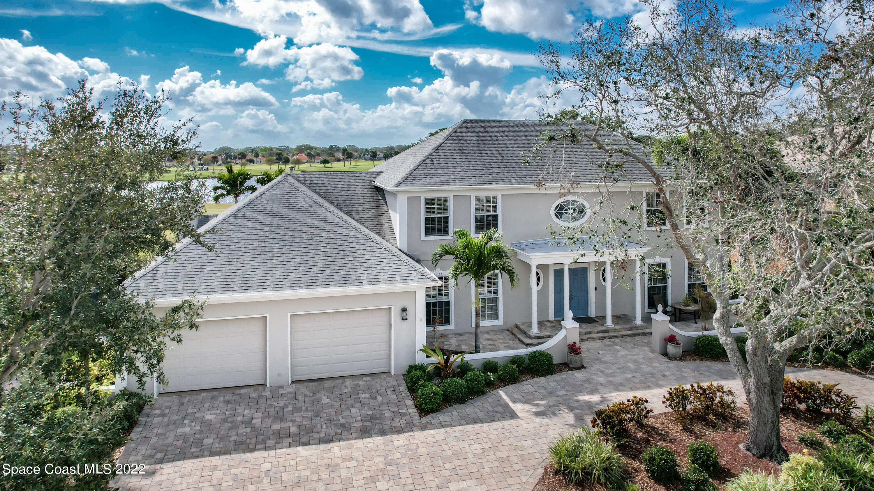870 Kerry Downs Circle Melbourne, FL 32940 - Photo 3 of 41 a front view of house with yard and trees
