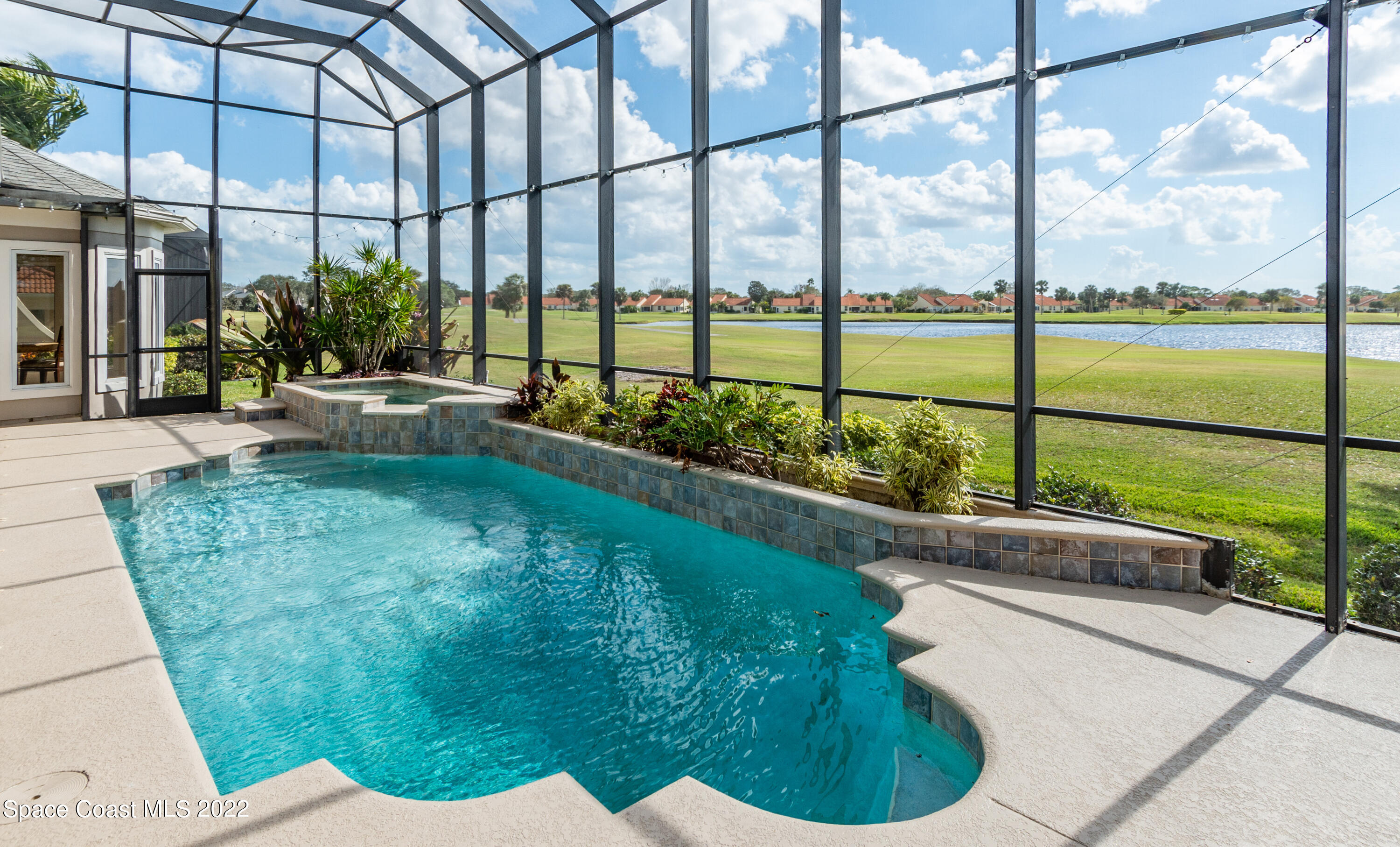 870 Kerry Downs Circle Melbourne, FL 32940 - Photo 32 of 41 a view of swimming pool from a balcony