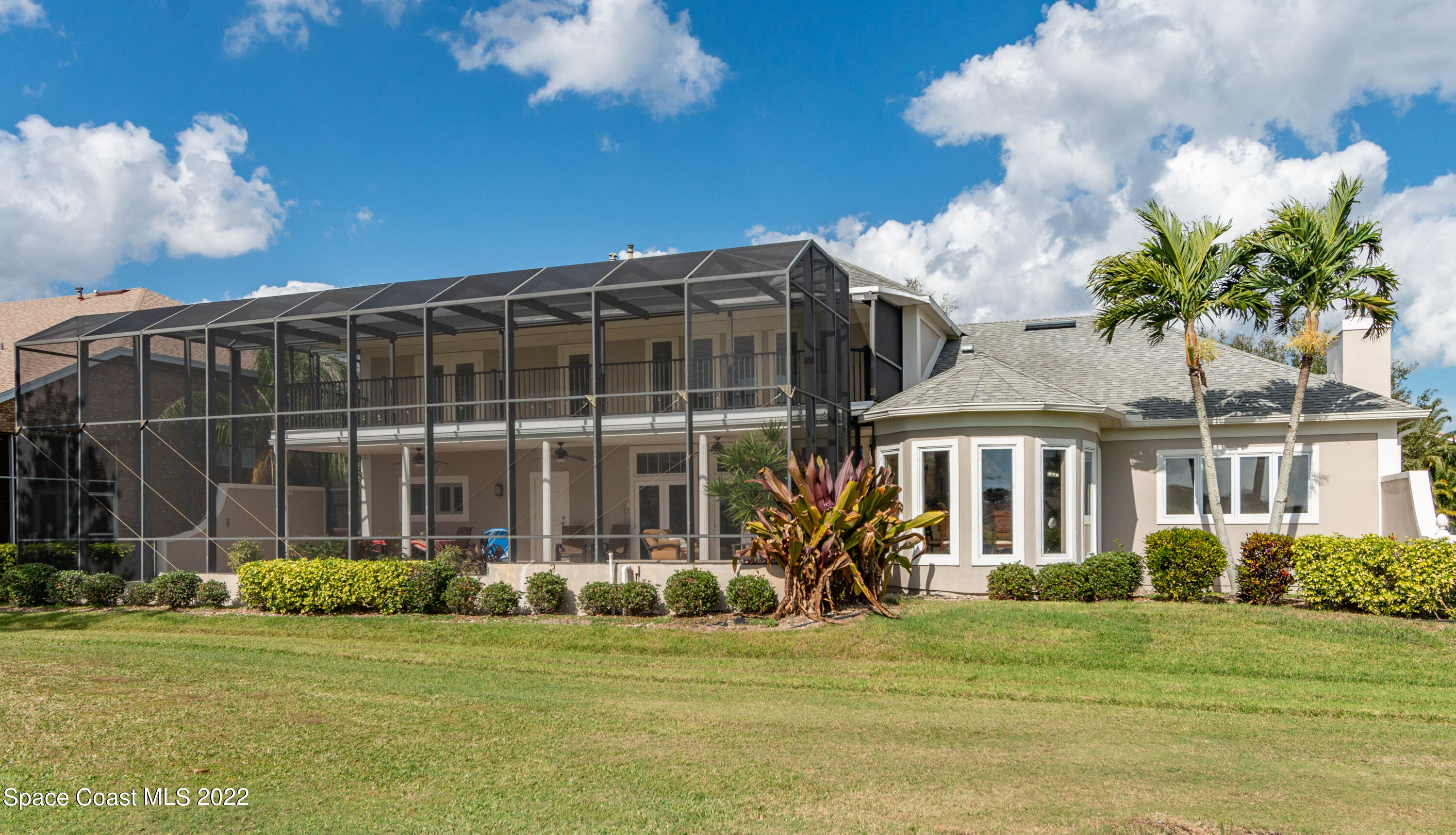 870 Kerry Downs Circle Melbourne, FL 32940 - Photo 35 of 41 a front view of a house with a garden