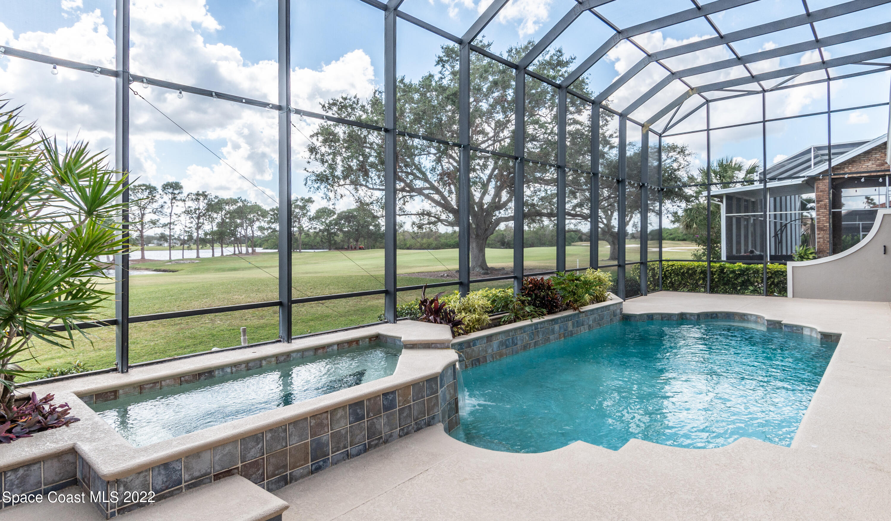 870 Kerry Downs Circle Melbourne, FL 32940 - Photo 7 of 41 a view of swimming pool with a sitting area