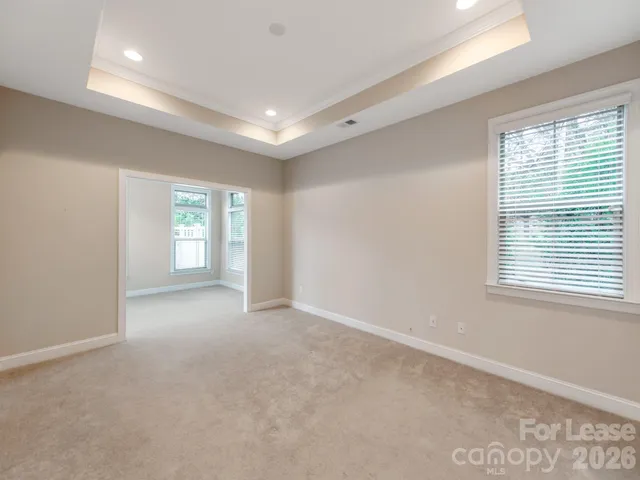 a view of empty room with windows