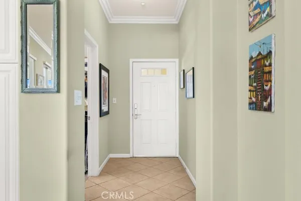 a view of a hallway with paintings on the wall