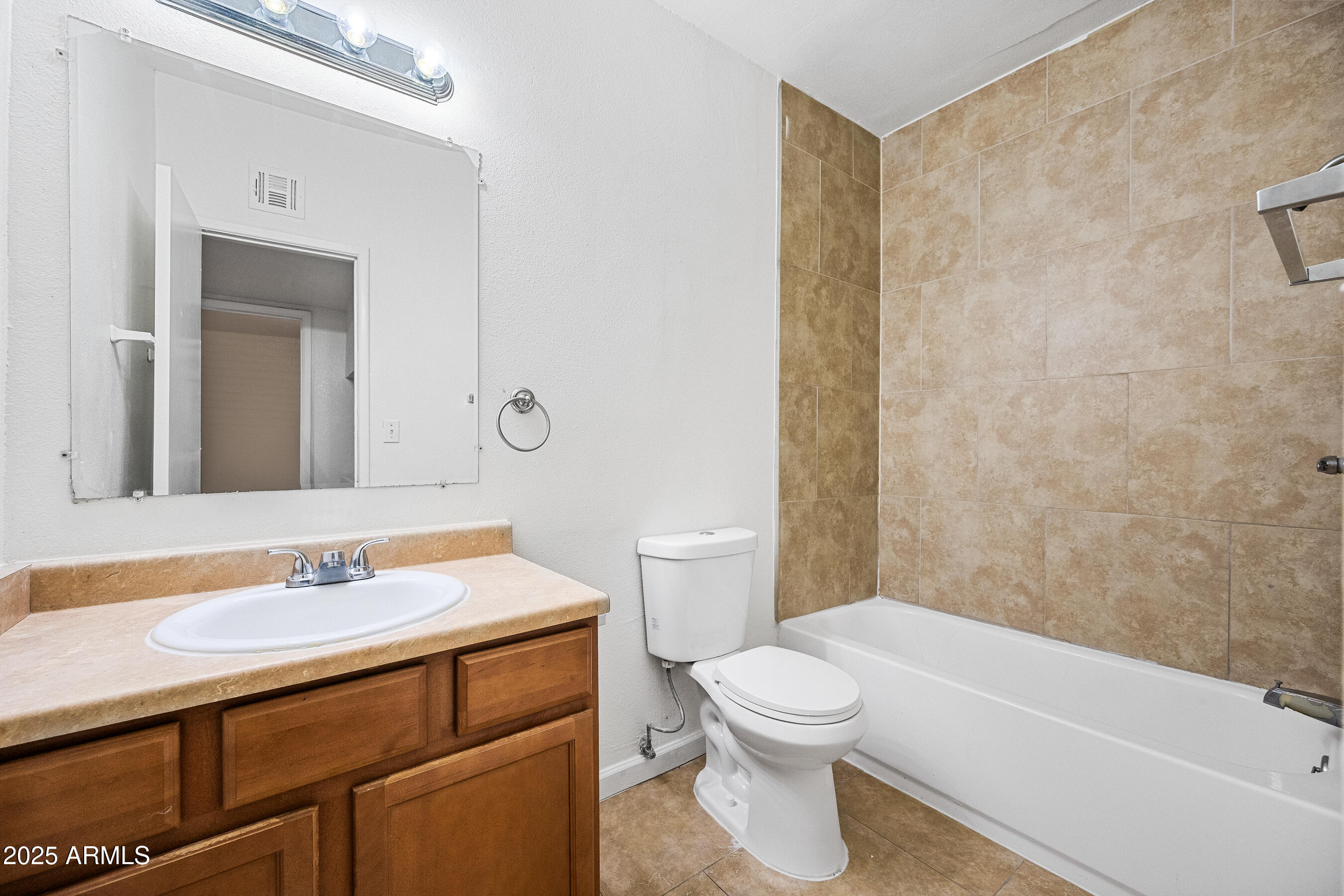 1518 West Colter Street, Unit 9 Phoenix, AZ 85015 - Photo 12 of 26 a bathroom with a sink a toilet and shower