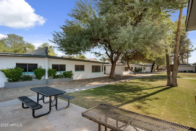 a view of a backyard with a patio