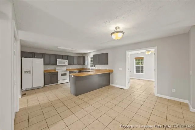 a room with a cabinets and washer dryer