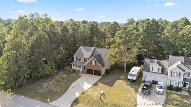 a view of a house with a yard balcony