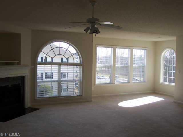 131 James High Point, Unit 3A High Point, NC 27265 - Photo 2 of 4 Other. Living/dining room has corner gas fireplace,vaulted ceiling,arched windows and open to kitchen.