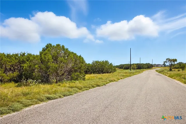 a view of a garden and basketball court