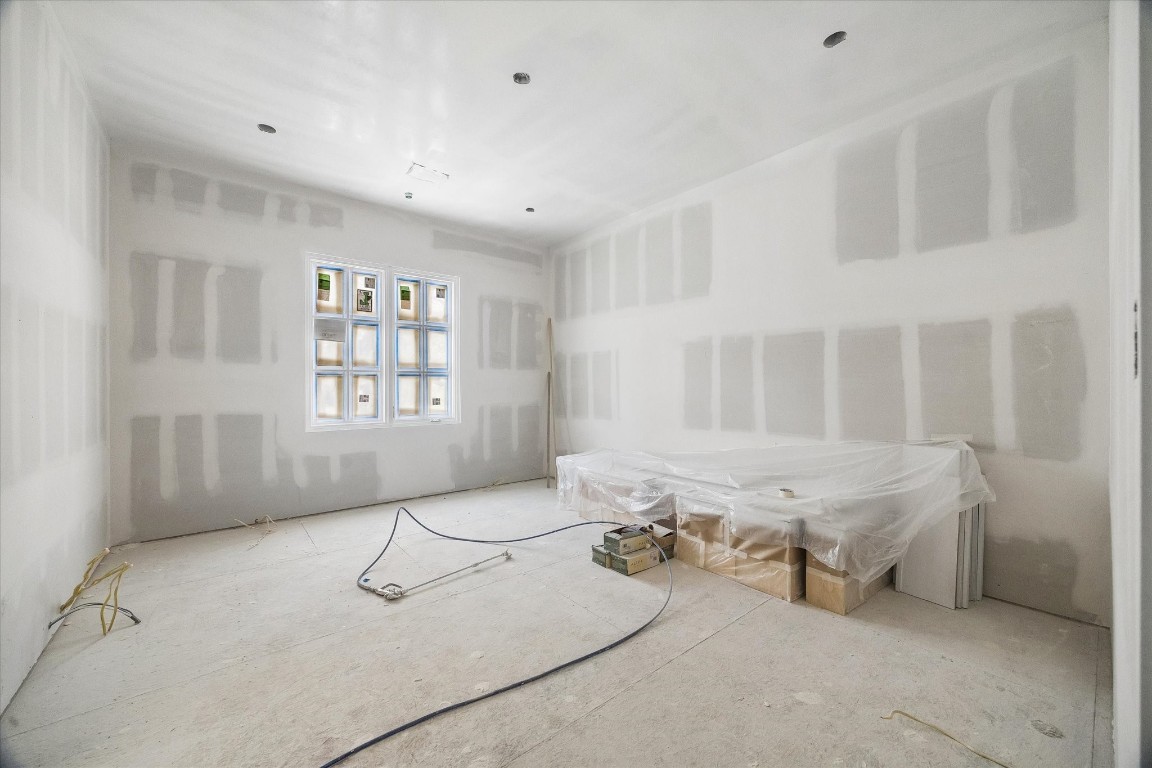 403 Trails Court Houston, TX 77024 - Photo 21 of 31 a living room with furniture a window and gym equipment