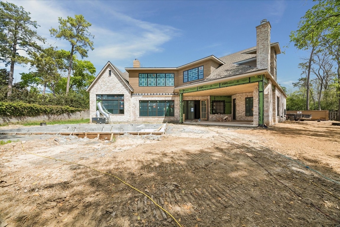 403 Trails Court Houston, TX 77024 - Photo 31 of 31 a front view of a house with a yard