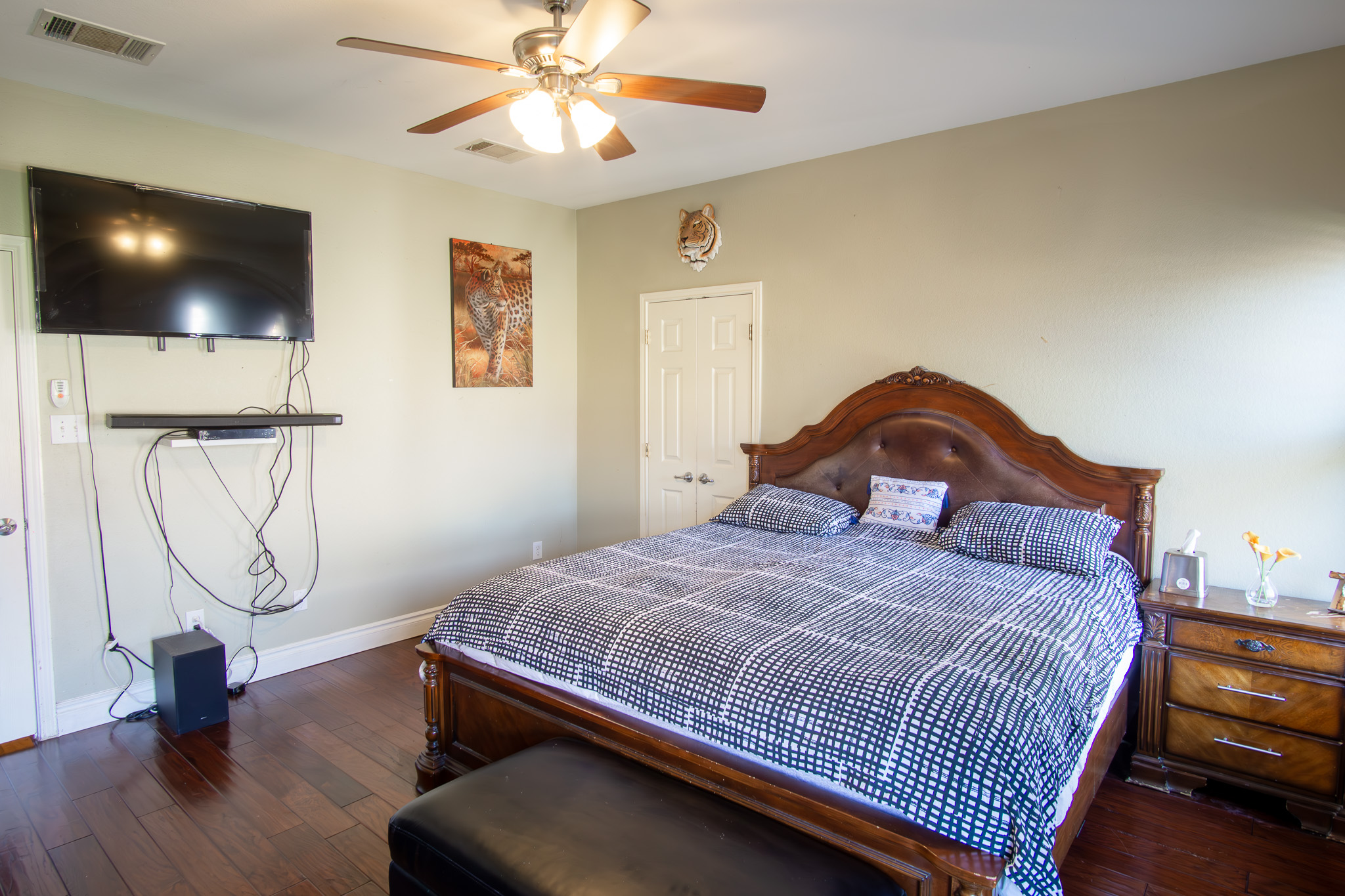 11500 Dimmit Street Manor, TX 78653 - Photo 11 of 20 a bedroom with a bed and a chandelier