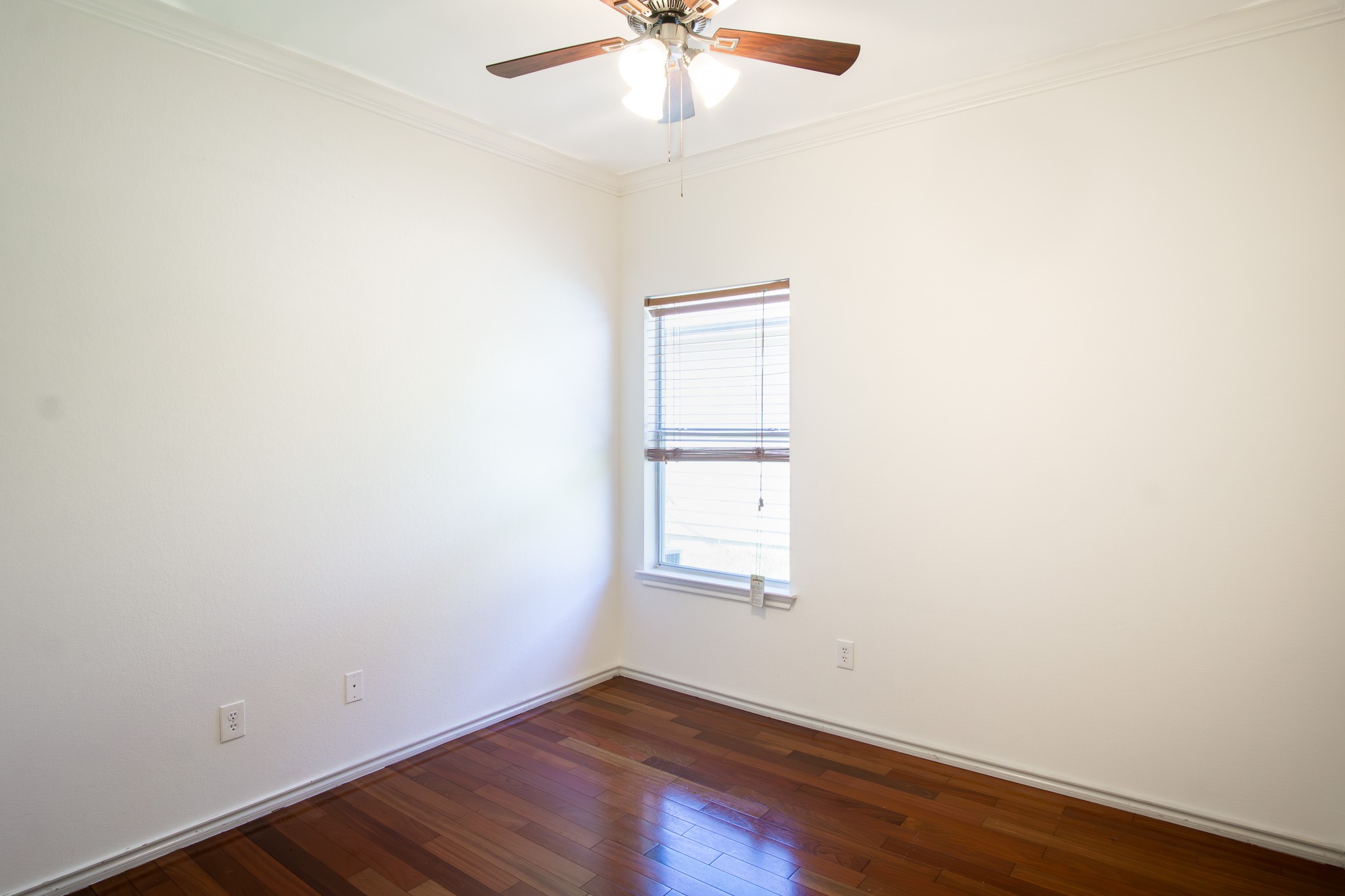 11500 Dimmit Street Manor, TX 78653 - Photo 14 of 20 an empty room with a window and a ceiling fan