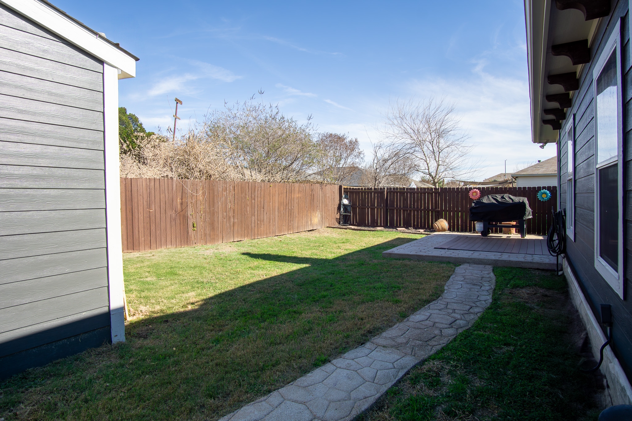 11500 Dimmit Street Manor, TX 78653 - Photo 18 of 20 a view of a backyard with pathway
