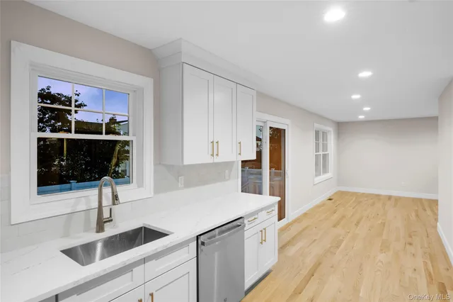 a kitchen with a sink and cabinets