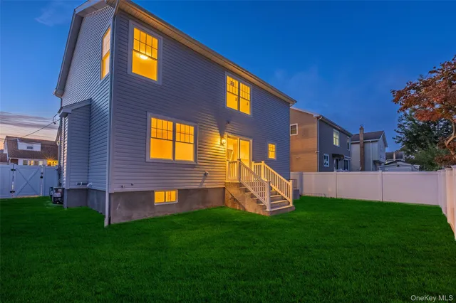 a front view of a brick house with a yard