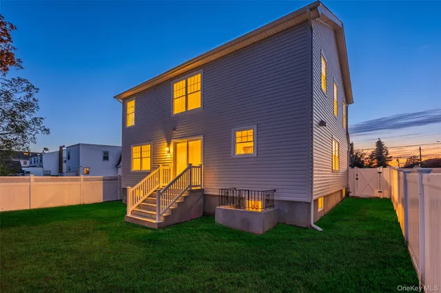 a view of a house with a backyard