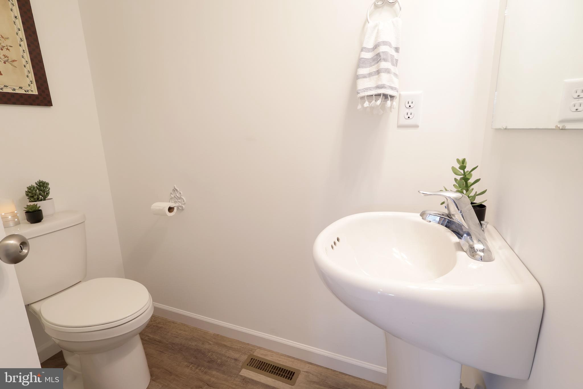 154 Magnolia Lane State College, PA 16803 - Photo 17 of 60 a bathroom with a sink and mirror with toilet