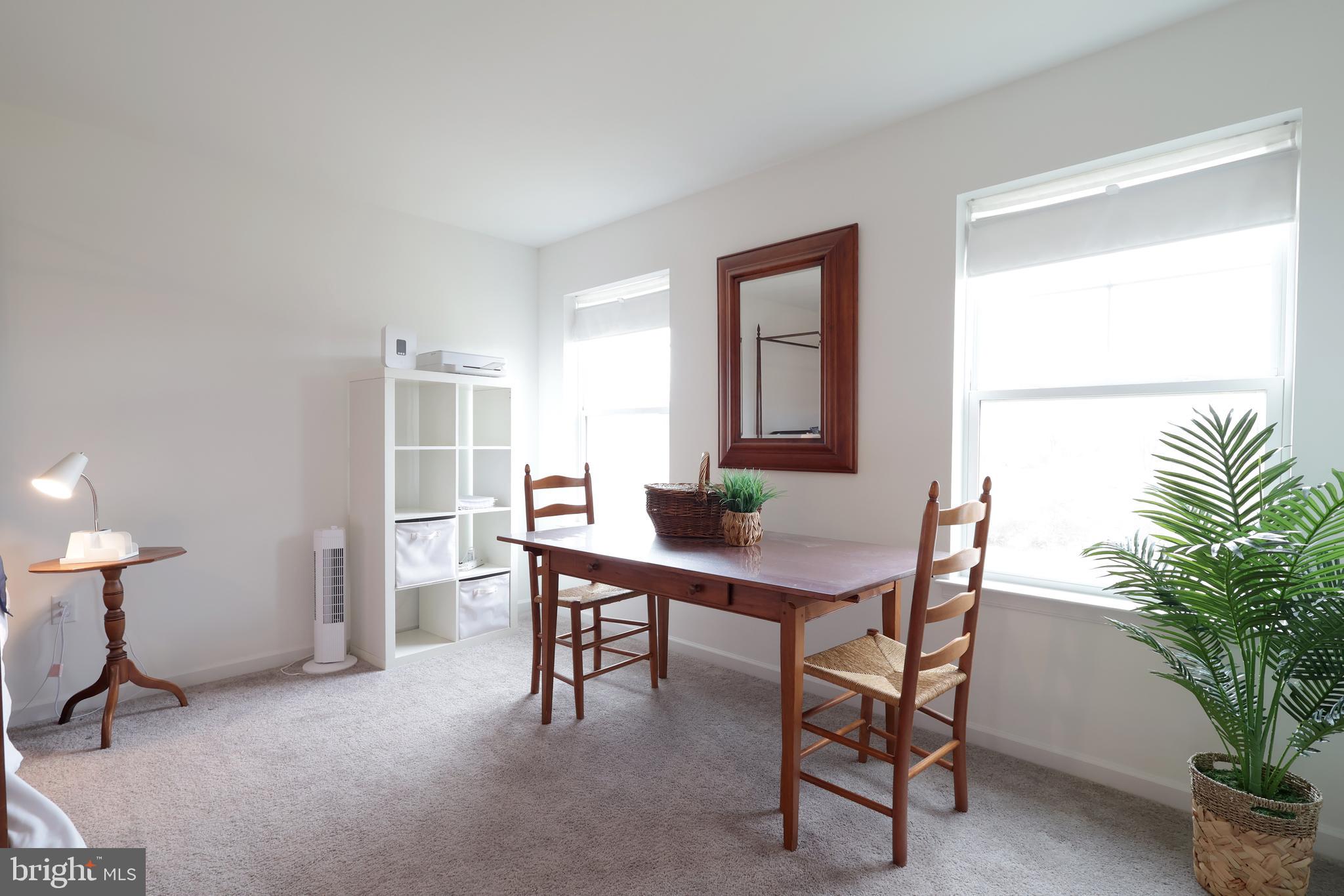 154 Magnolia Lane State College, PA 16803 - Photo 30 of 60 a view of a workspace with furniture and a potted plant