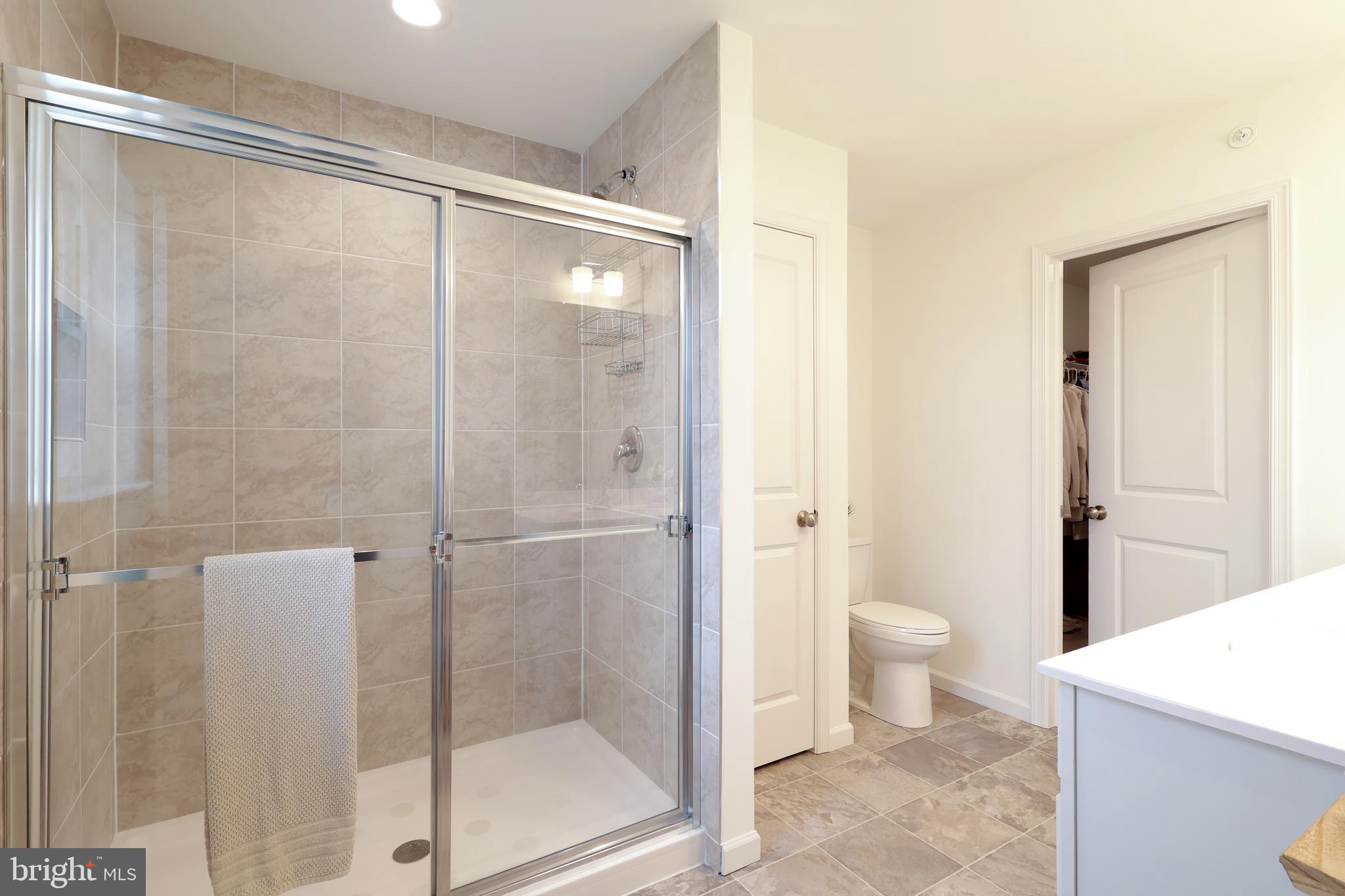 154 Magnolia Lane State College, PA 16803 - Photo 32 of 60 a bathroom with a granite countertop sink toilet and shower