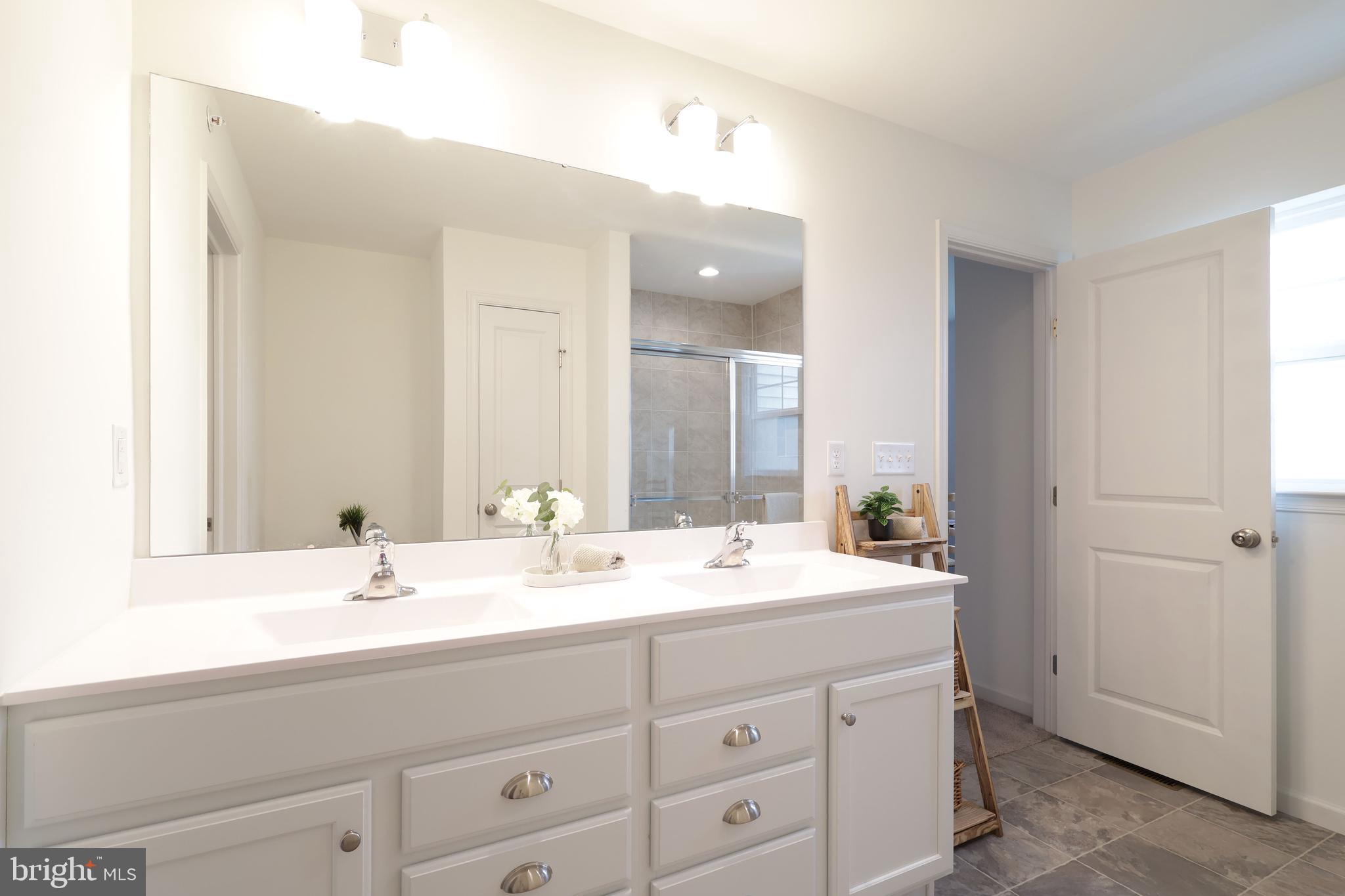 154 Magnolia Lane State College, PA 16803 - Photo 33 of 60 a bathroom with a sink and a mirror