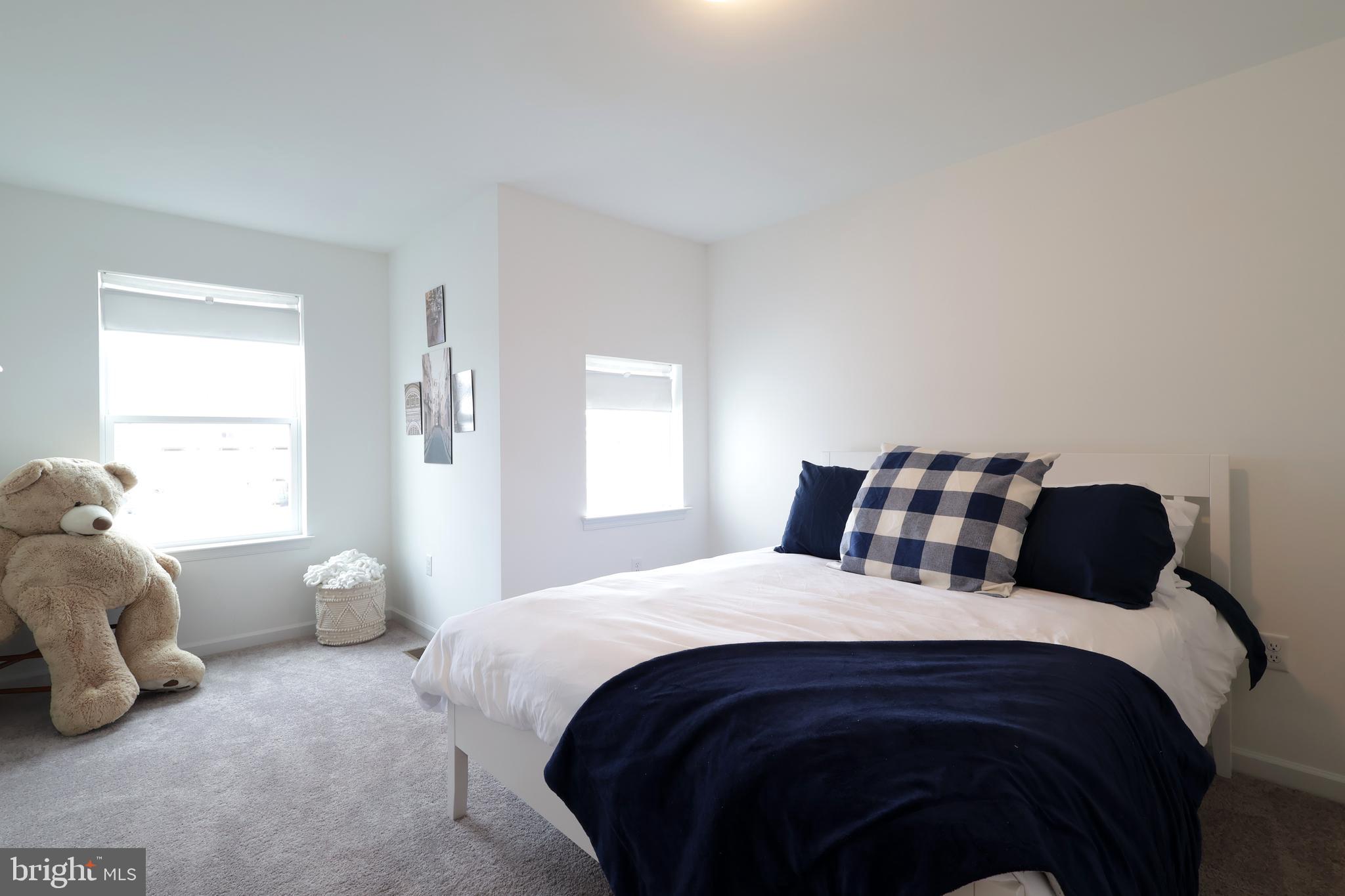 154 Magnolia Lane State College, PA 16803 - Photo 36 of 60 a bedroom with a bed and window